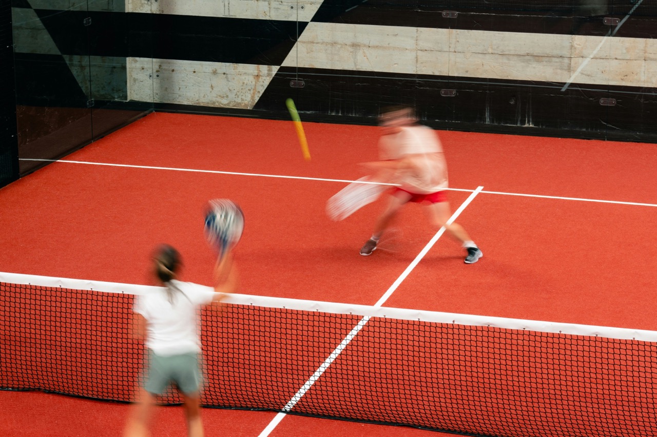 Padel players in action on the court